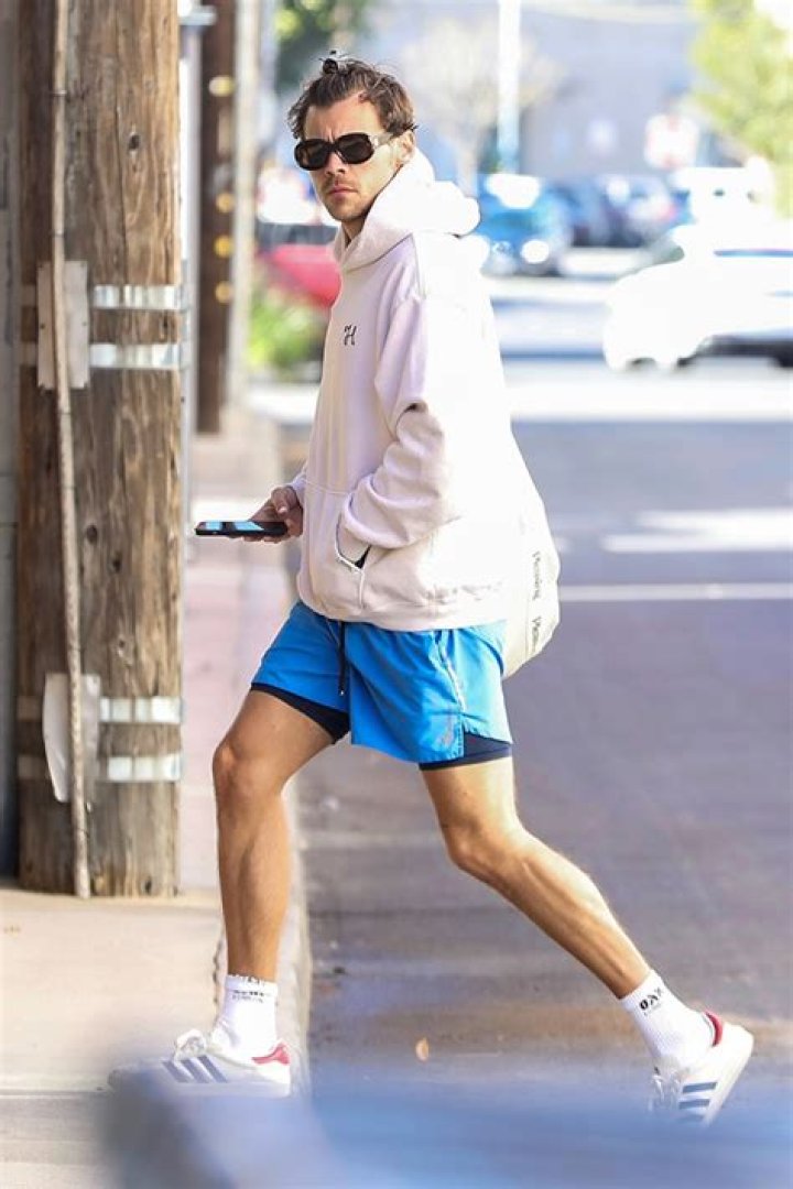 Harry Styles Rocks Shorts As He Heads To Gym After Winning AOTY At The Grammys: Photo