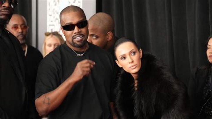 Kim Kardashian Looks Happy While Cuddling With Hairstylist Tae As Kanye West Is Seen Without Wedding Ring